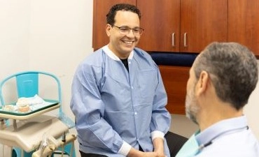 Dentist and patient talking